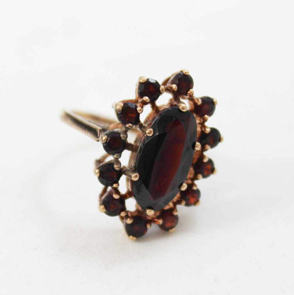 Appraisal: GARNET AND NINE KARAT GOLD RING with twelve round-cut garnets