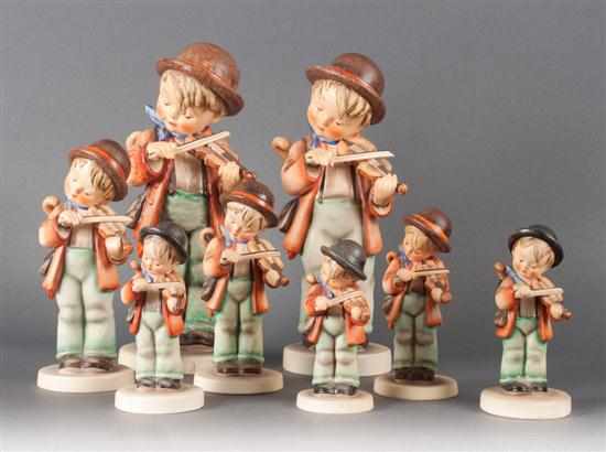 Appraisal: Eight Hummel painted earthenware graduated ''Little Fiddler'' figurines Estimate -