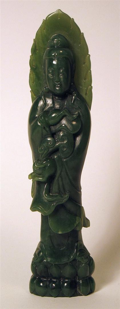 Appraisal: Chinese green jade quanyinDepicting The goddess dressed in typical attire