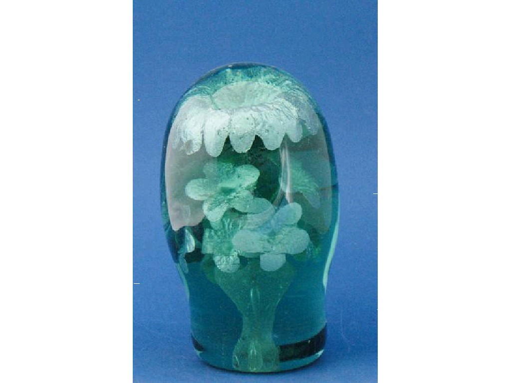 Appraisal: A GREEN GLASS DUMP PAPERWEIGHT internally decorated with a vase