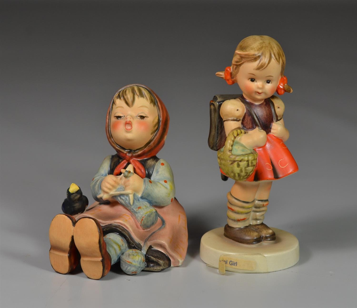 Appraisal: Goebel Hummel Figurines Happy Pasttime crazing West Germany Schoolgirl West