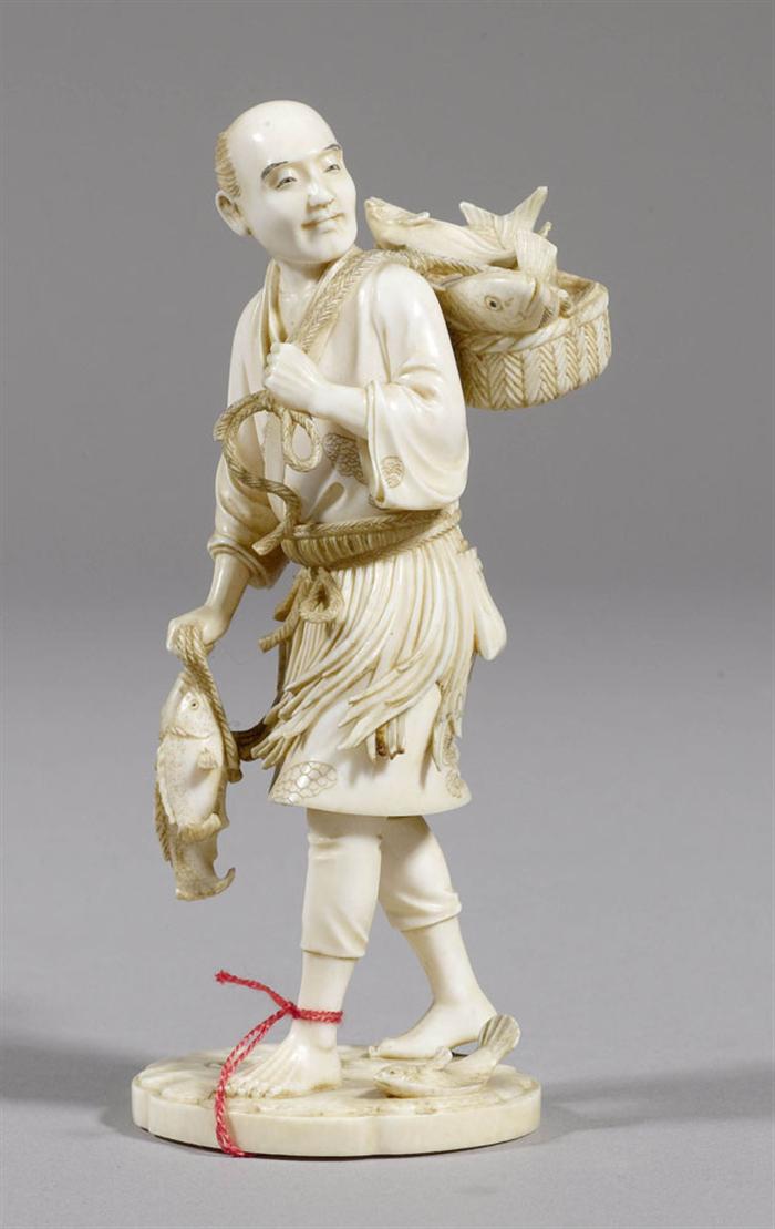 Appraisal: AN IVORY OKIMONO OF A FISHERMAN Japan Meiji period H