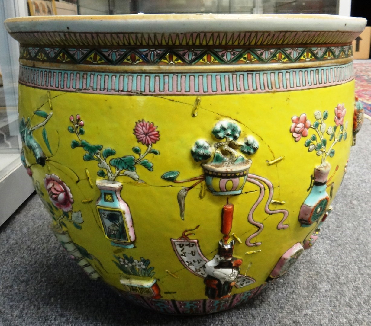 Appraisal: A Chinese famille-rose yellow ground fish bowl late th century