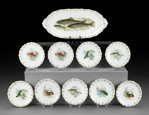 Appraisal: A Limoges porcelain fish service early th century Comprising oval