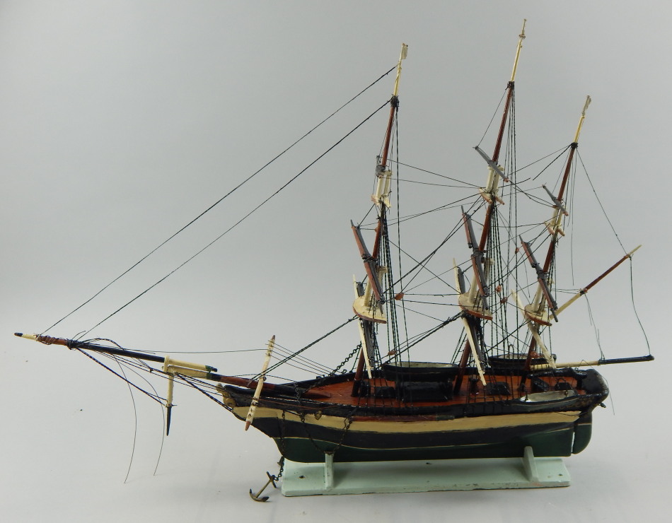 Appraisal: A painted model of a full masted sailing ship on