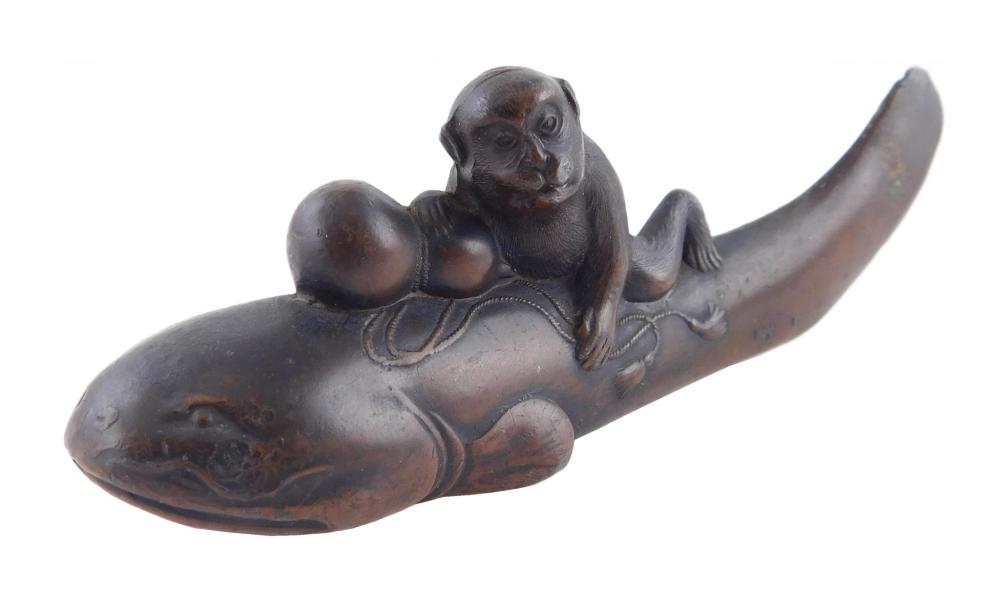 Appraisal: ASIAN Japanese bronze of a monkey holding a gourd and