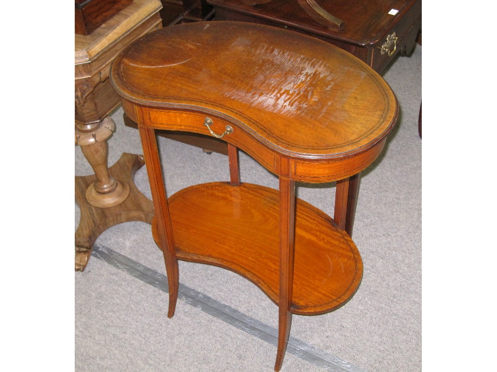 Appraisal: Edwardian satinwood kidney shaped side table on outswept tapered supports