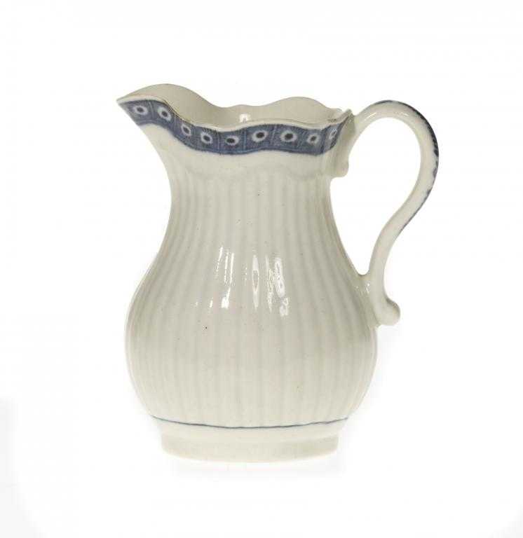 Appraisal: A WORCESTER REEDED CREAM JUG of baluster shape painted in