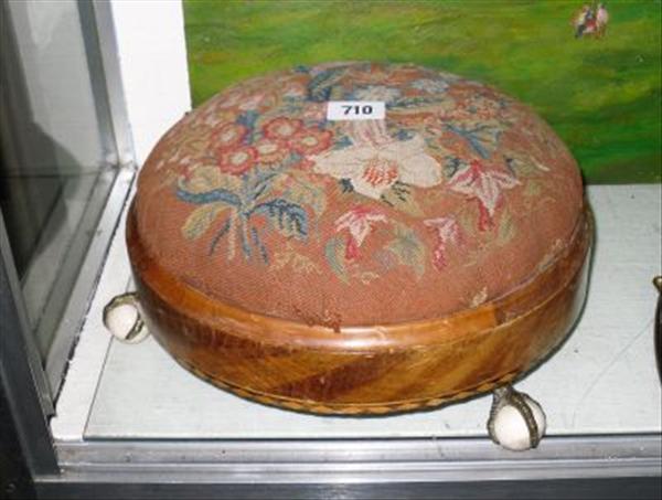 Appraisal: A Victorian walnut circular footstool parquetry inlaid with chevrons on