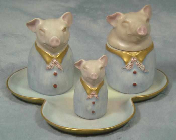 Appraisal: Limoges figural pig shaker and mustard jar set on tray