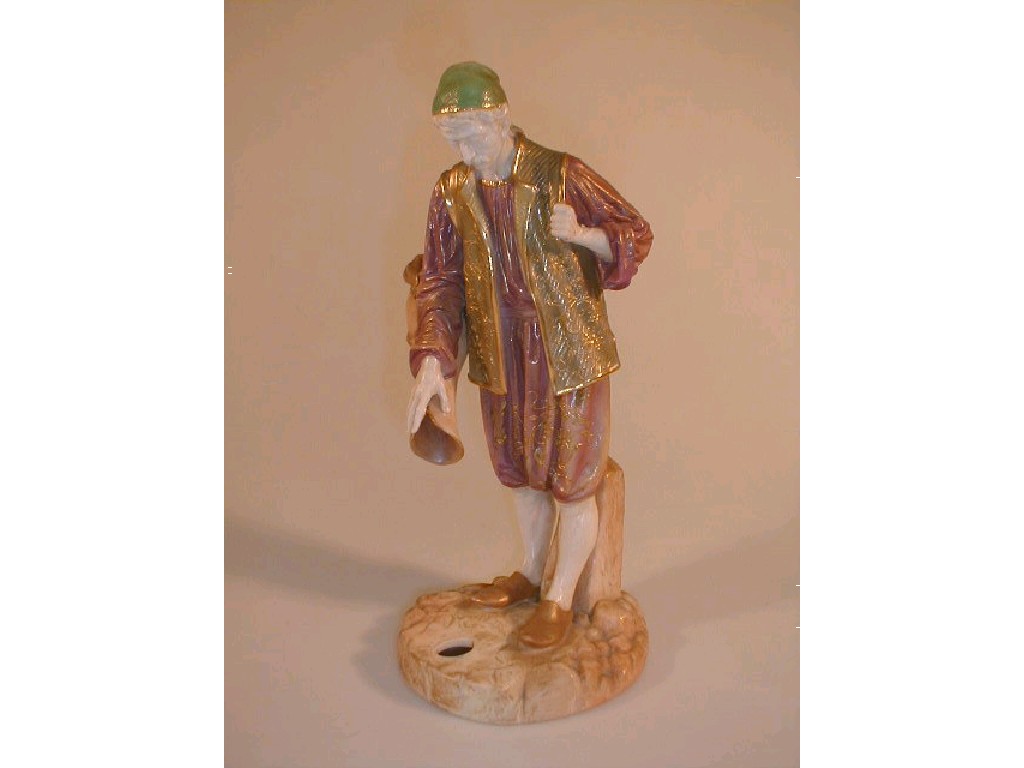 Appraisal: A Royal Worcester Cairo ware figure of a male water