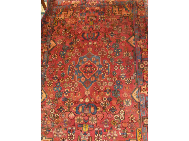 Appraisal: NEHAVEND THROW RUG The soft red field of floral design