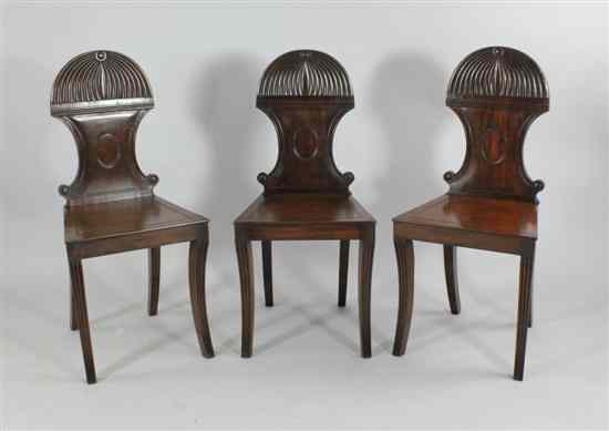 Appraisal: Three Regency mahogany hall chairs in the manner of Gillows