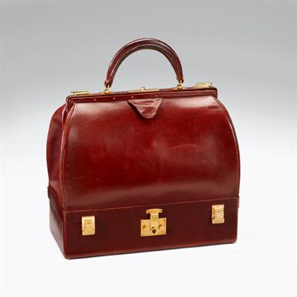 Appraisal: Hermes oxblood leather train case mid th century With clamshell-hinged