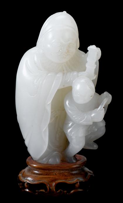 Appraisal: Chinese white jade figure and attendant Qing dynasty Single-piece carving