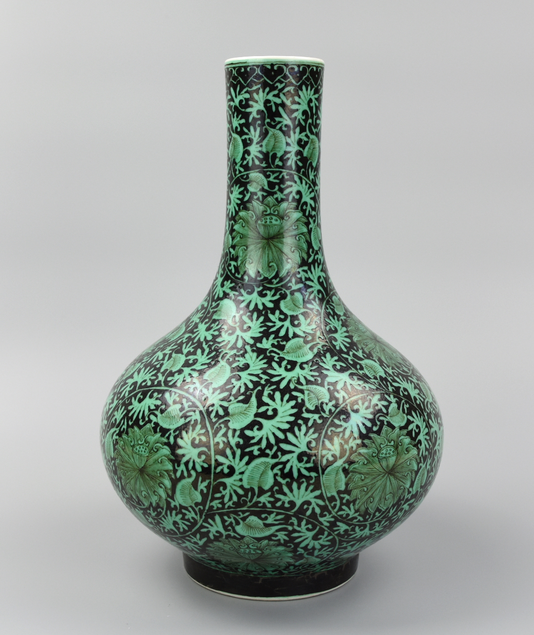 Appraisal: CHINESE BLACK GROUND GREEN LOTUS VASE TH C A Chinese