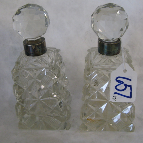 Appraisal: PAIR SHEFFIELD STERLING HALLMARKED PERFUMES The cut crystal square-form bottles