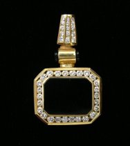 Appraisal: An Onyx and Diamond Enhancer Striking Kt yellow gold enhancer