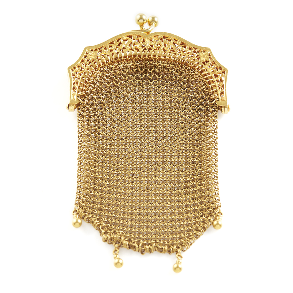 Appraisal: A continental mesh purse the cantle with pierced foliate detail