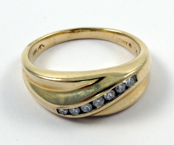 Appraisal: MAN'S DIAMOND WEDDING BAND the K yellow gold heavy mount