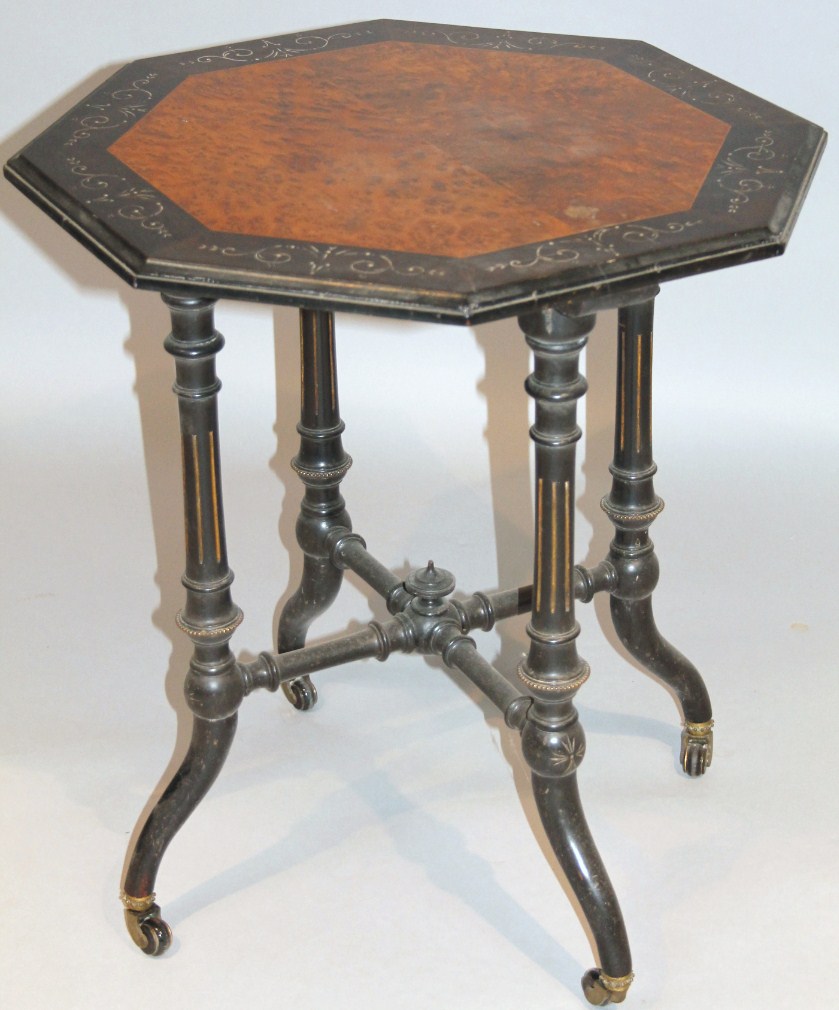 Appraisal: A thC ebonised occasional table the octagonal top with an