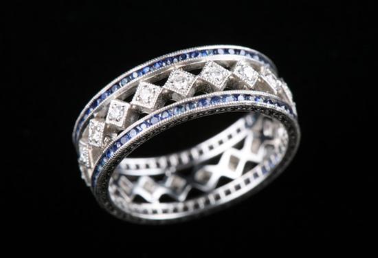 Appraisal: PLATINUM SAPPHIRE AND DIAMOND BAND Centered with openwork band of