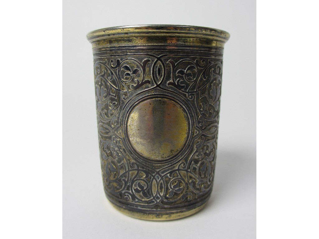 Appraisal: A Russian silver niello vodka cup with circular plain cartouche