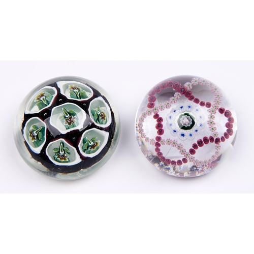 Appraisal: A French garland paperweight mm and another glass paperweight More