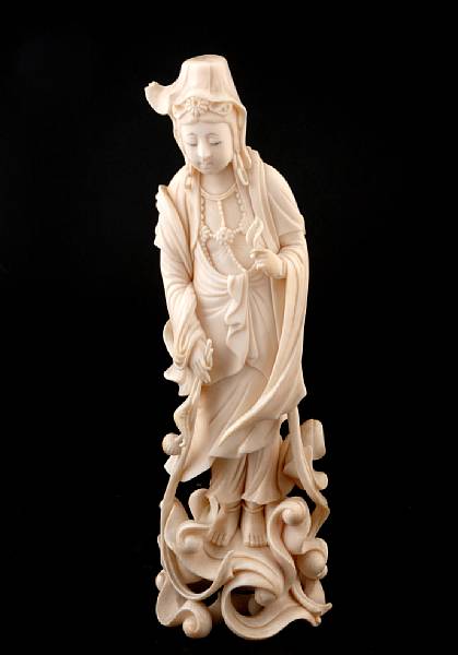 Appraisal: A Chinese ivory standing figure of Guanyin small losses height