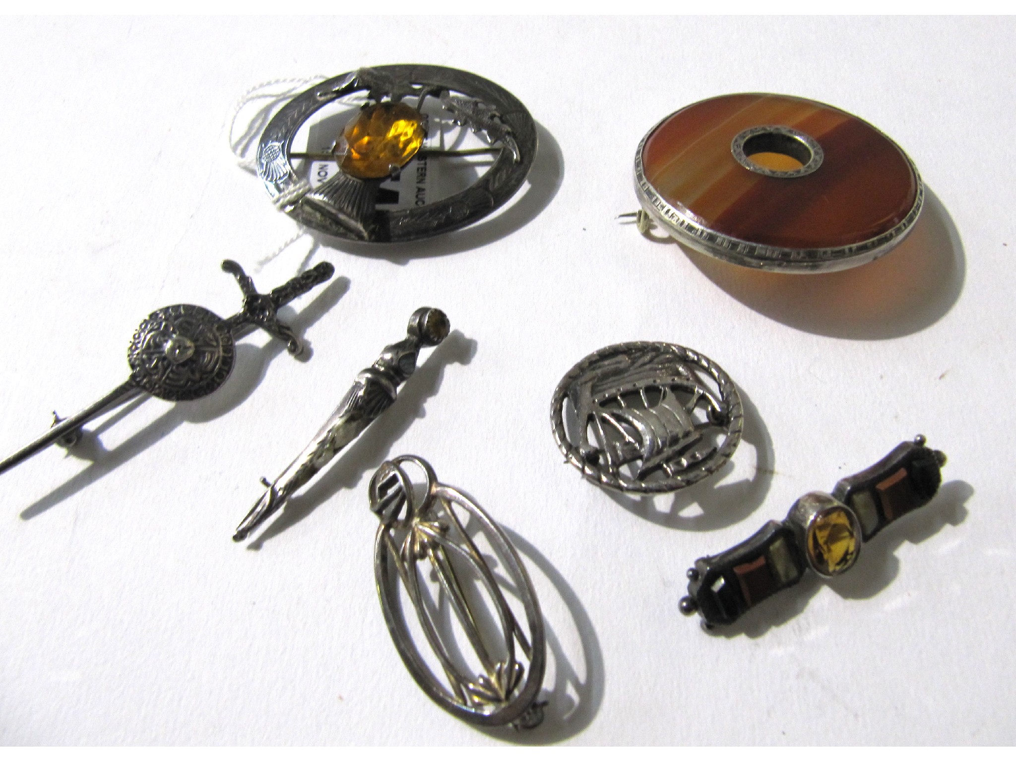 Appraisal: A lot comprising five Scottish silver brooches and one other