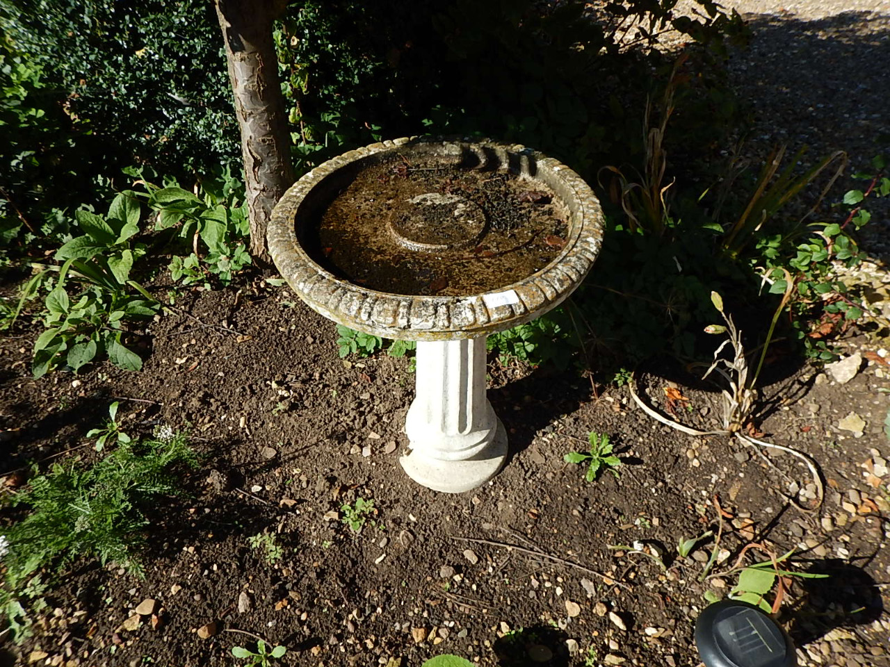 Appraisal: A stone bird bath of classical circular design on fluted