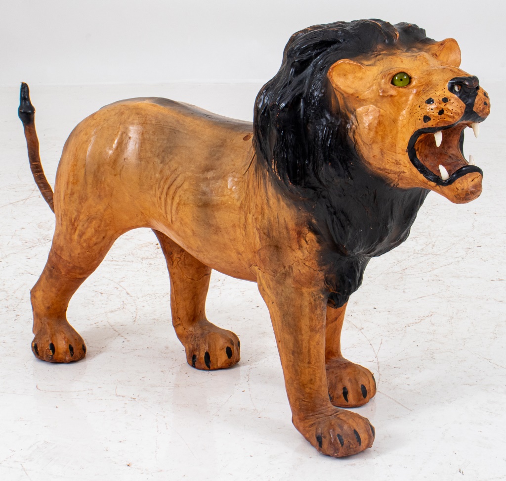 Appraisal: NATURALISTIC PAPIER MACHE FIGURE OF A LION Naturalistic papier mache