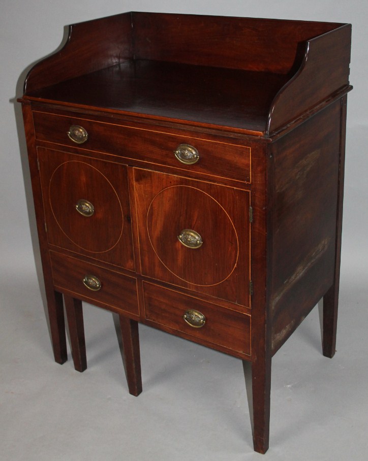 Appraisal: A Georgian mahogany night chest with a three part galleried