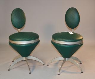 Appraisal: Pair of Mid-Century egg shaped swivel chairs silver painted steel