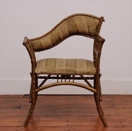 Appraisal: VICTORIAN GILT TWIG AND SPINDLE ARMCHAIR The asymmetrical serpentine padded