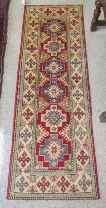 Appraisal: TWO HAND KNOTTED ORIENTAL AREA RUGS Pakistani Caucasians overall geometric