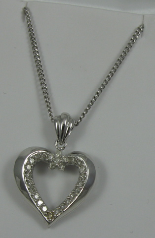 Appraisal: DIAMOND AND WHITE GOLD HEART PENDANT NECKLACE the k white