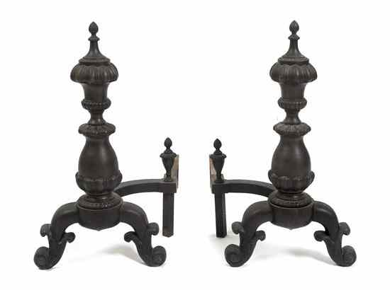 Appraisal: A Pair of Cast Iron Andirons each having a sphere