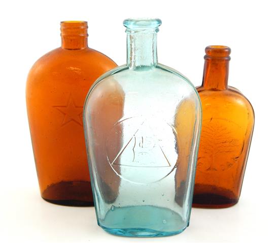 Appraisal: GLASS Group of three flasks THE OAK amber half pint