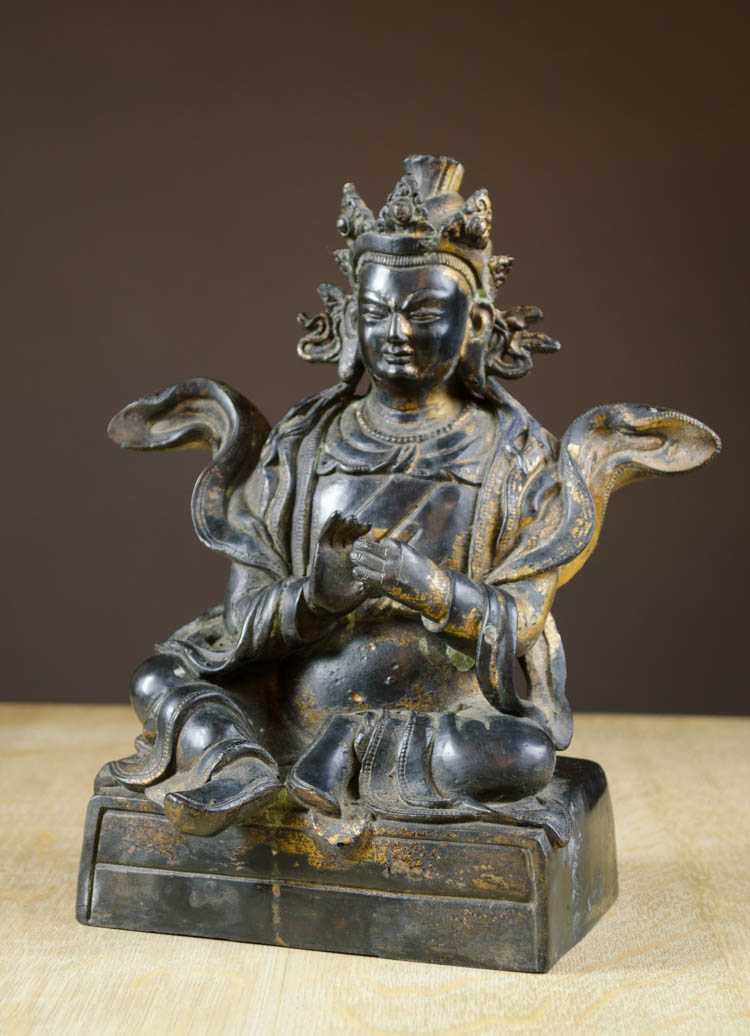 Appraisal: BRONZE BUDDHA FIGURE seated Gautama Buddha figure raised on rectangular