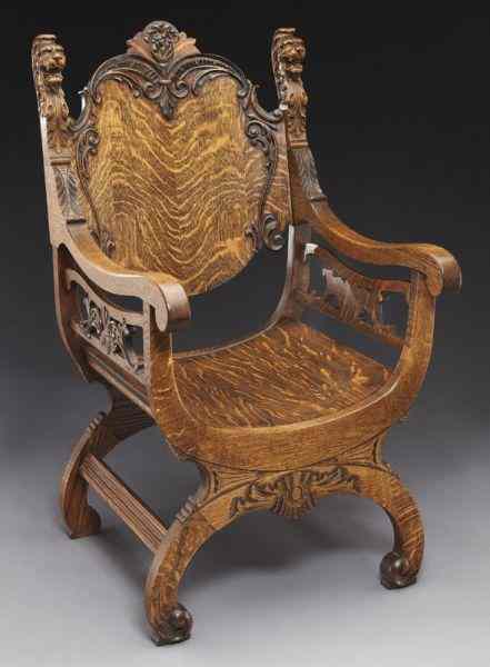 Appraisal: Continental tiger oak Savonarola throne chairof typical form with foliate