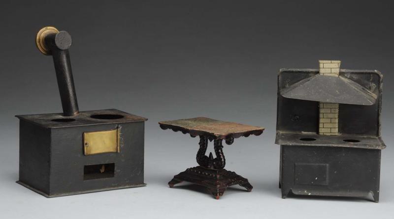 Appraisal: Lot of Doll House Furniture Two black tin stoves and