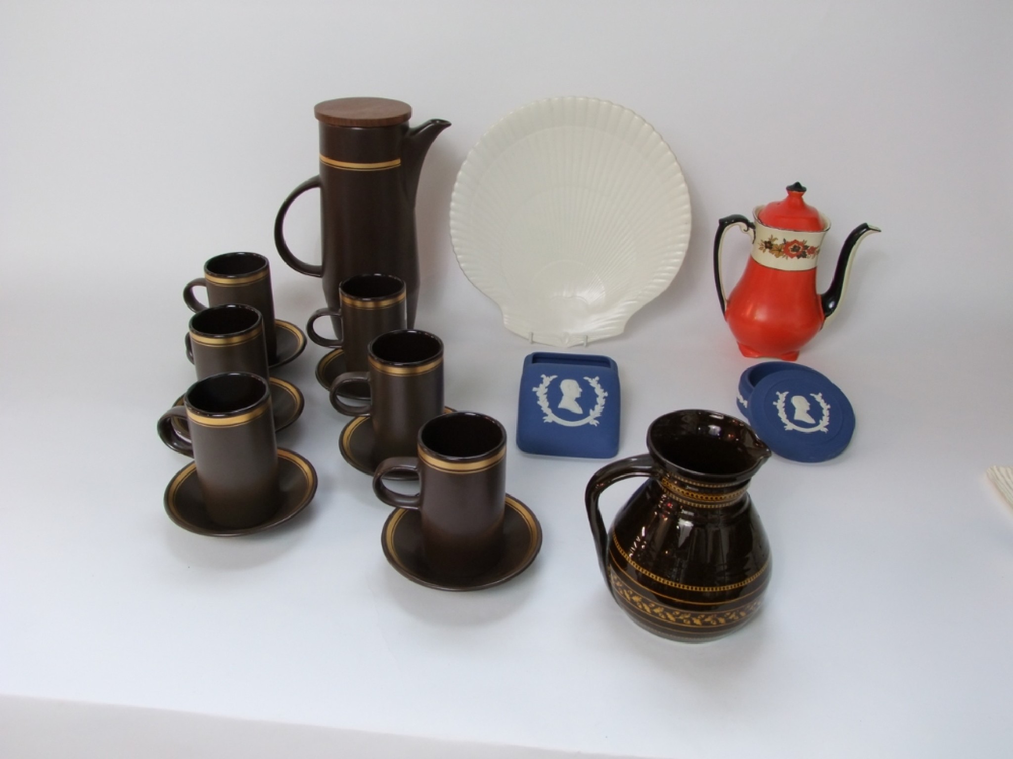 Appraisal: A collection of Purbeck Pottery brown glazed coffee wares comprising