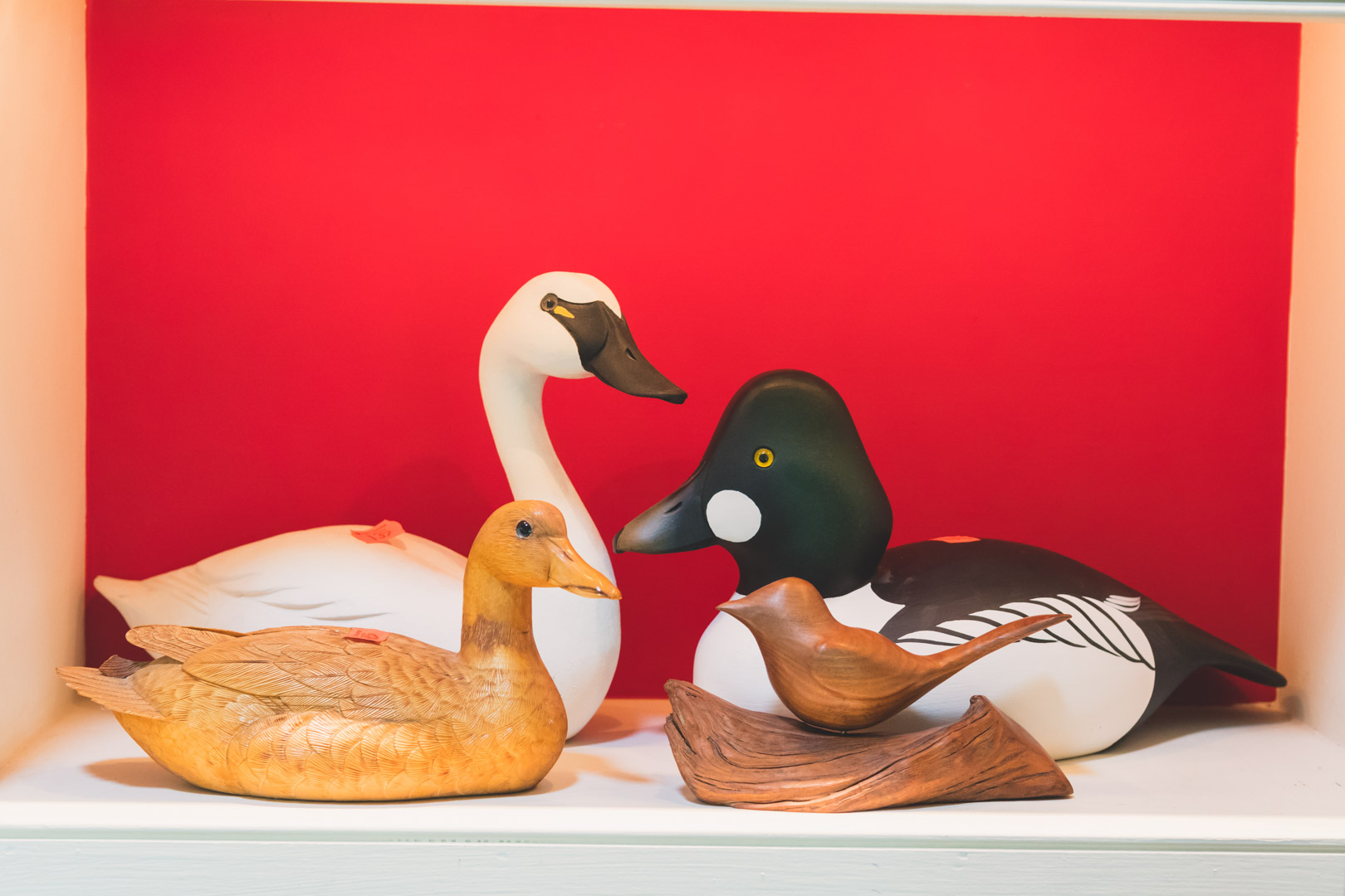 Appraisal: four carved and painted wood duck figures including Golden Eye