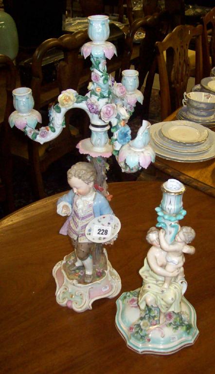 Appraisal: A Meissen candelabra decorated with a figure of a young