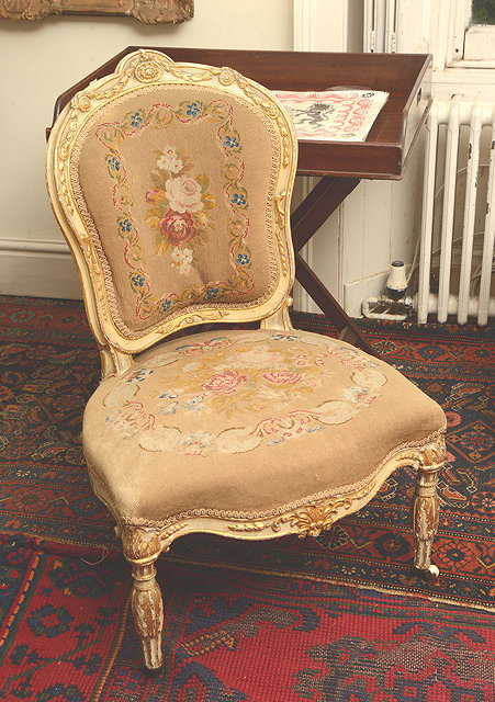 Appraisal: A LOUIS XV STYLE SALON CHAIR with gilded and carved