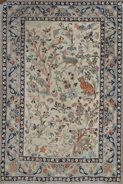 Appraisal: A TABRIZ WHITE GROUND MAT decorated symbols and birds amongst