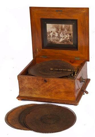 Appraisal: A VICTORIAN GERMAN POLYPHON with discs contained within a walnut