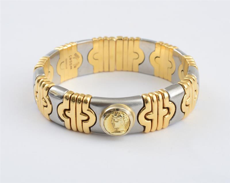 Appraisal: K GOLD AND STEEL PARENTHESI BANGLE BULGARI Spring mounted bracelet