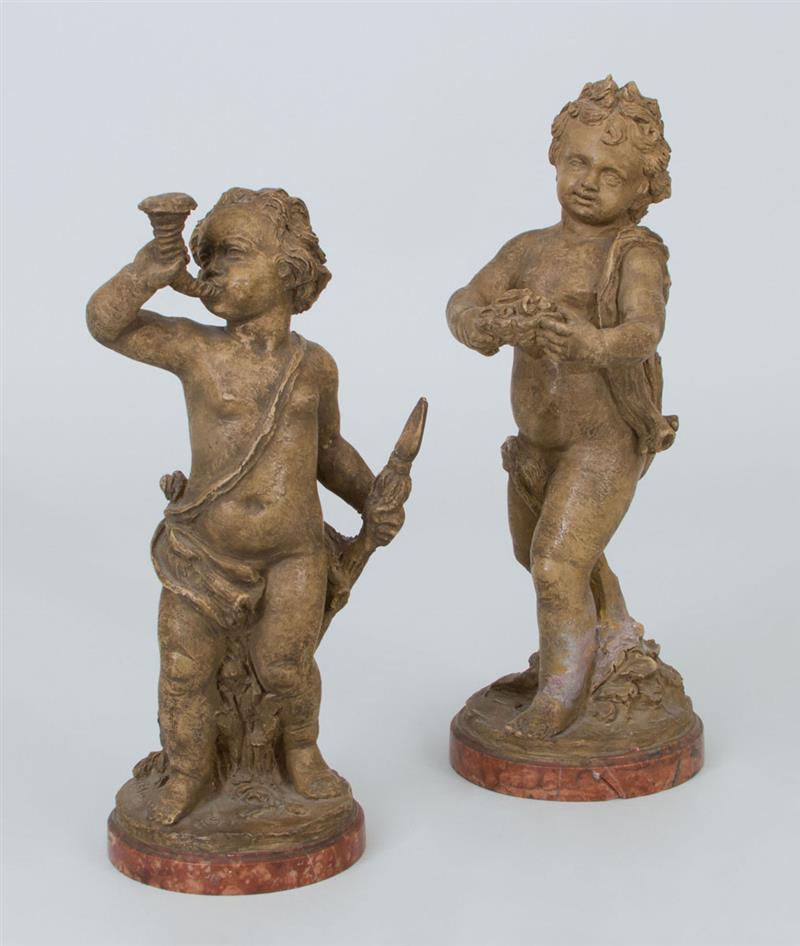 Appraisal: Two Continental Molded Terracotta Figures of Putti On marble bases